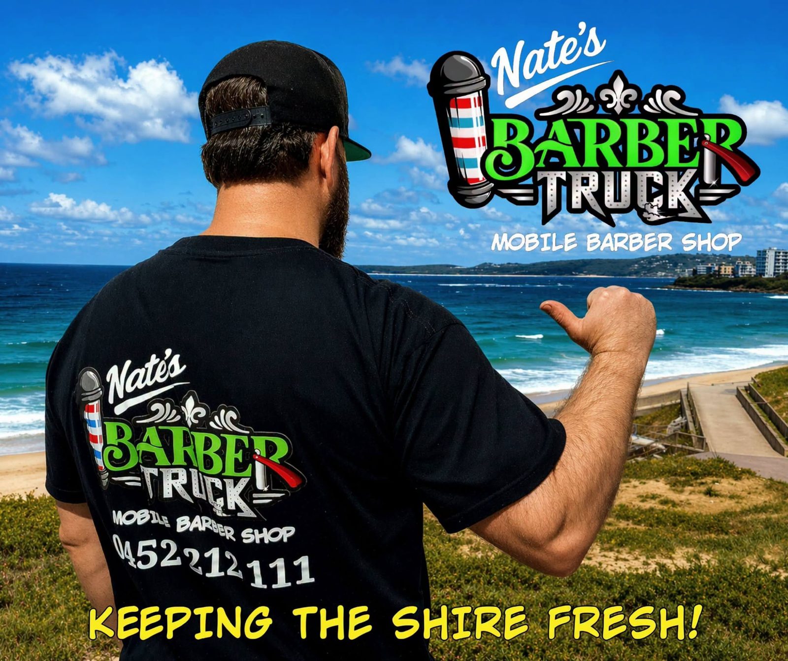 Nate pointing to the Barber Truck logo on his shirt, overlooking the beach
