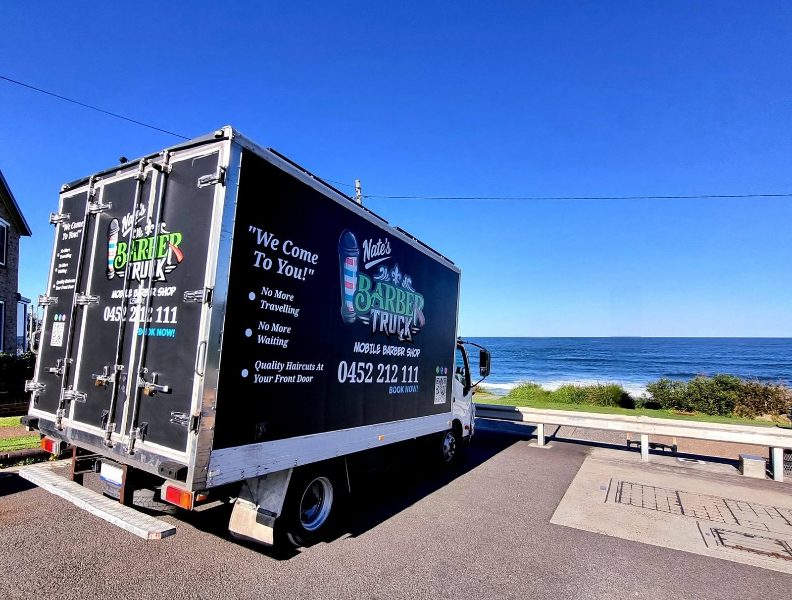 Nate's Barber Truck parked by the ocean in the Sutherland Shire